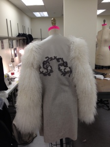 Front view of hand embroidered leather, tissue cashmere coat